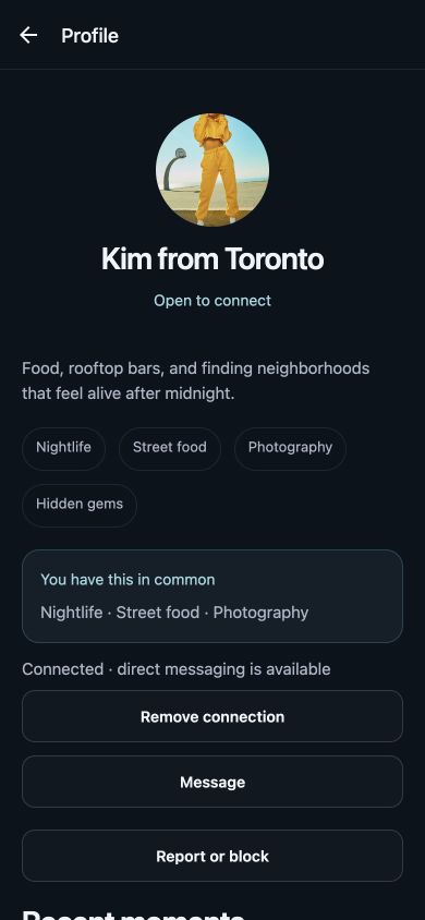 TrvlBē profile with a photo, shared interests, and connection status